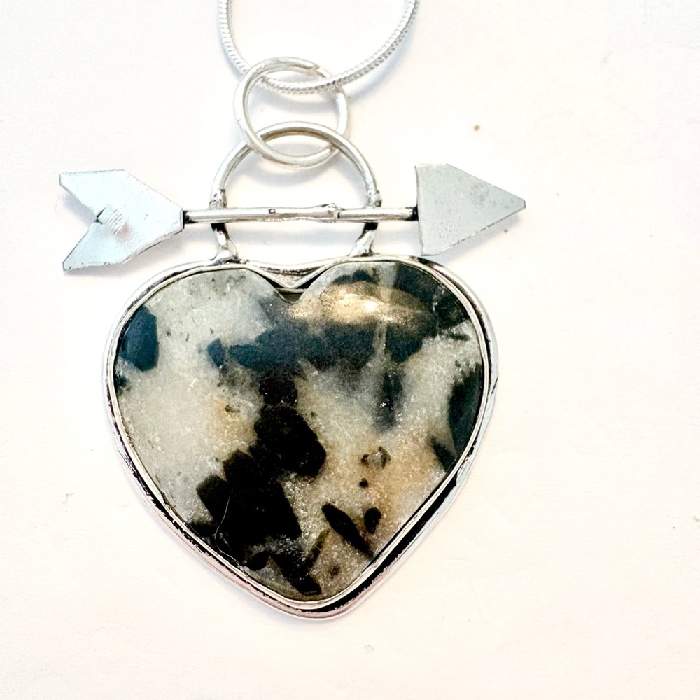 1 1/2 in. Hornblende heart shaped pendant, with arrow, on a silver chain